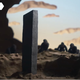 Apes crouch around a monolith in a claymation recreation of a scene from 2001: A Space Odyssey.